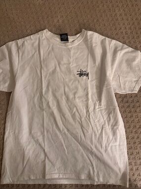 Stussy White Short Sleeve Tee with Black Chest Logo